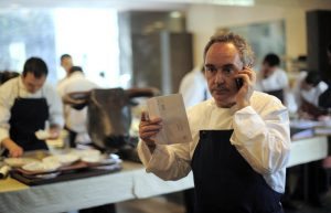 FILE - In this March 30, 2011 file photo, Spanish chef Ferran Adria as he speaks on the phone in his restaurant elBulli in Roses, Spain. El Bulli, one of the world's most acclaimed and award-winning eateries, is preparing to serve its last supper before closing. After a final dinner for staff families on Saturday, July 30, 2011, Adria will begin work on turning the restaurant into a food foundation he hopes to open in 2014.(AP Photo/Manu Fernandez, file)