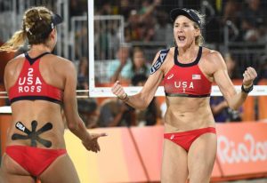 USA's April Ross (L) and Kerri Walsh Jennings celebrate after winning a point during the women's beach volleyball bronze medal match between Brazil and the USA at the Beach Volley Arena in Rio de Janeiro on August 17, 2016, for the Rio 2016 Olympic Games. / AFP / Leon NEAL (Photo credit should read LEON NEAL/AFP/Getty Images)